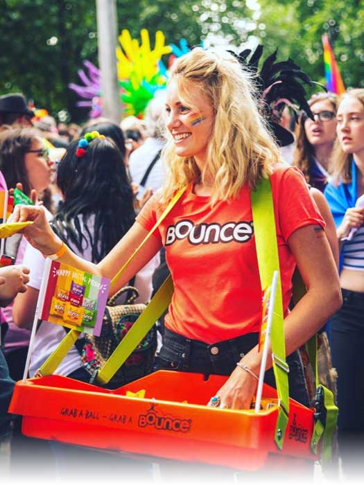 Custom branded orange usherette trays at a festival