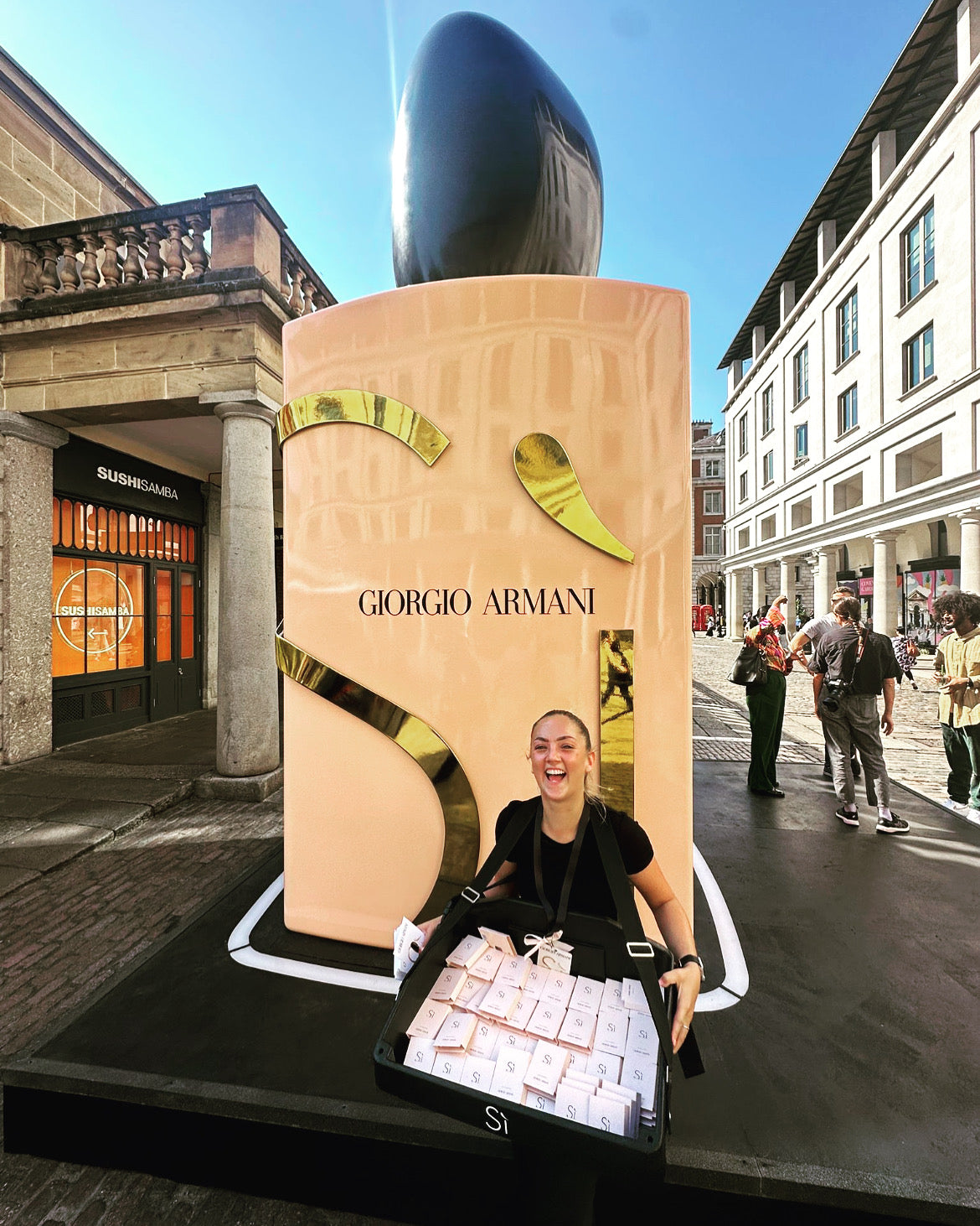 Giorgio Armani branded usherette tray at a brand activation