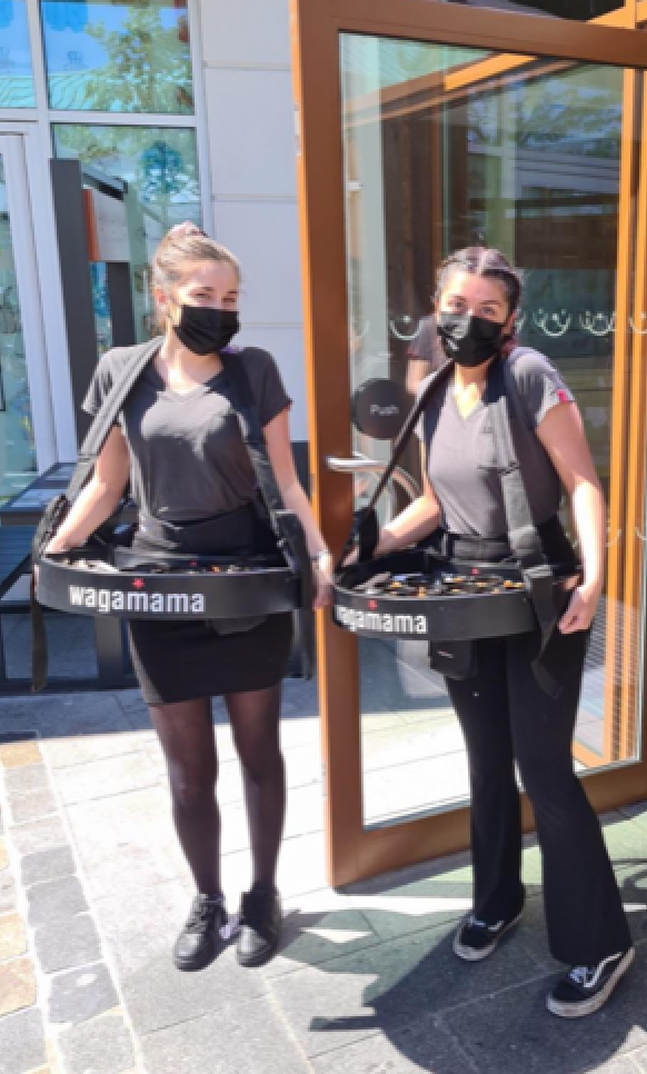 Wagamama curved usherette trays sampling hot food